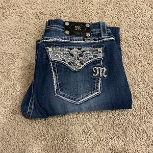 Miss Me jeans size 31 mid rise easy boot. Inseam is a 33.